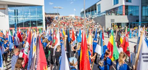 Young international athletes with national flags in IIAAF championship&#039;s opening ceremony in Ratina area.